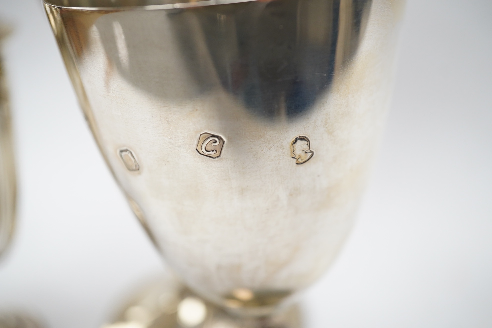 A Victorian engraved silver presentation goblet, with Masonic inscription, London, 1880, 19.5cm, together with a modern silver presentation goblet and a silver two handled presentation trophy cup and cover, 20.2oz. Condi